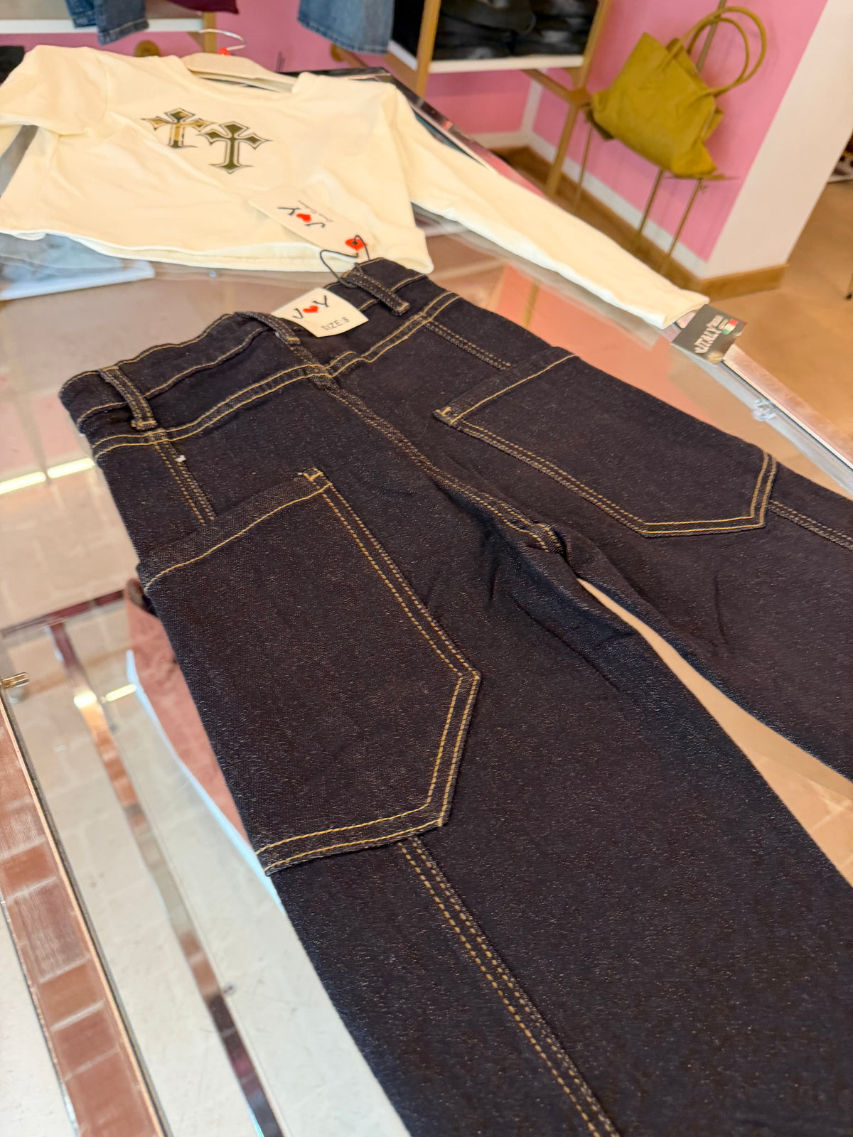 Jeans, croci colorate