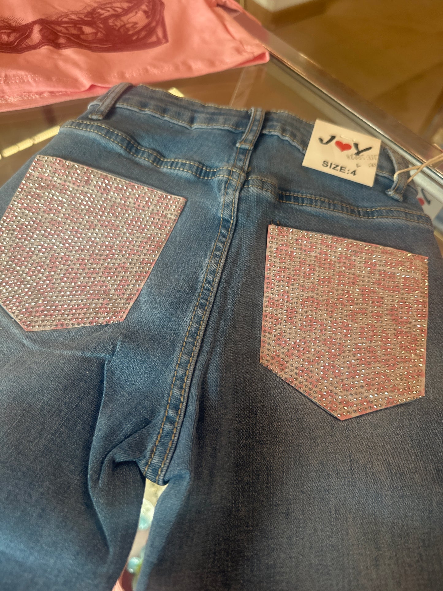 Jeans tasca rosa